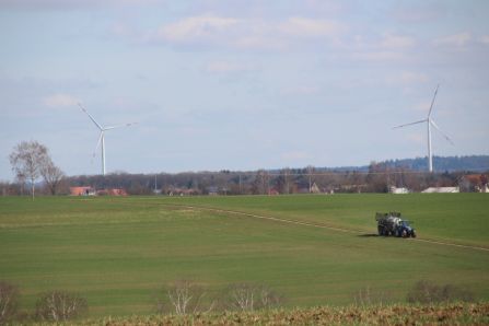 fields with tractor and windmill